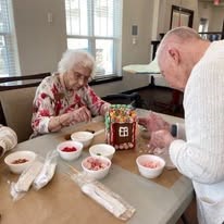 Osprey Heights Gracious Retirement Living Hawthorn Senior Independent Living in Valrico, Florida residents decorating gingerbread houses