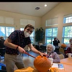 Providence Meadows Gracious Retirement Living Hawthorn Senior Independent Living in Charlotte, North Carolina residents carving pumpkins in the fall