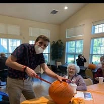 Providence Meadows Gracious Retirement Living Hawthorn Senior Independent Living in Charlotte, North Carolina residents carving pumpkins in the fall