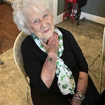 An Orchard Ridge resident showing off her festive St. Patrick's Day attire at their event
