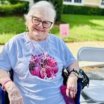 Sonata Coconut Creek senior smiling on an outdoor walk