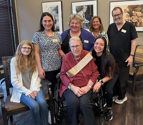 The Legacy of DeForest, WI, smiling resident during birthday celebration