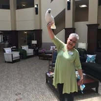 Ascension Living Via Christi Village Georgetown Senior Independent Living in Wichita, Kansas resident holding a bird