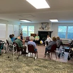 The Lodge at Wake Forest Gracious Retirement Living Hawthorn Senior Independent Living in Wake Forest, North Carolina residents playing a game