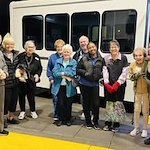 Sequoia Grove Gracious Retirement Living Hawthorn Senior Independent Living in Granite Bay, California residents standing in front of the transportation bus