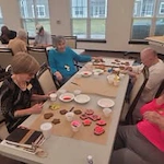 Osprey Heights Gracious Retirement Living Hawthorn Senior Independent Living in Valrico, Florida residents decorating cookies
