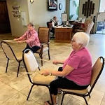 The Peaks At Santa Rita Active Retirement Living Hawthorn Senior Independent Living in Green Valley, Arizona residents playing drums on chairs