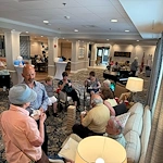 Charter Senior Living of Dedham in Dedham, MA, residents visiting in a welcoming environment