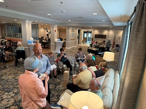Charter Senior Living of Dedham in Dedham, MA, residents visiting in a welcoming environment