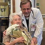 The Chateaus at Montclair Senior Memory Care in Shreveport, LA resident holding a bouquet