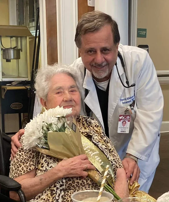 The Chateaus at Montclair Senior Memory Care in Shreveport, LA resident holding a bouquet