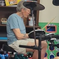 Scholl Canyon Estates Gracious Retirement Living Hawthorn Senior Independent Living in Glendale, California resident playing the drums