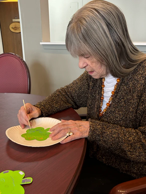 American House Elmwood, senior living community offering independent living, assisted living, memory care, and respite care in Rochester Hills, MI, resident making art