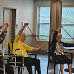 Astral at Auburn, senior living community offering independent living, assisted living, and memory care in Auburn, IN, residents staying active during a exercise class