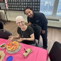 alishan Gracious Retirement Living Hawthorn Senior Independent Living in Spring Hill, Florida resident making food with a staff member