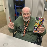 Charter Senior Living of Brookfield resident smiles with crafts