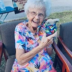Hidden Lakes Senior Living Community Vero Beach, FL, smiling resident with a bunny