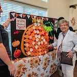 The Savoy Gracious Retirement Living Hawthorn Senior Independent Living in Winter Springs, Florida resident playing a pumpkin game