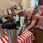 The Peaks At Santa Rita Active Retirement Living Hawthorn Senior Independent Living in Green Valley, Arizona resident in front of the coffee bar