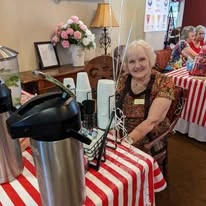 The Peaks At Santa Rita Active Retirement Living Hawthorn Senior Independent Living in Green Valley, Arizona resident in front of the coffee bar