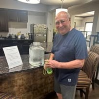 The Rio Grande Gracious Retirement Living Hawthorn Senior Independent Living in Rio Rancho resident filling his water bottle