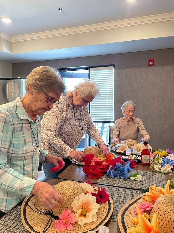 Calumet Trace - a Charter Senior Living Community resident activity - decorating hats