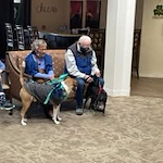 Stone Lodge Gracious Retirement Living Hawthorn Senior independent Living in Bend, Oregon residents petting service dogs