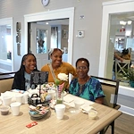 American House Farmington Hills, senior living community offering independent living, assisted living, memory care, and respite care in Farmington Hills, MI, resident smiling with family