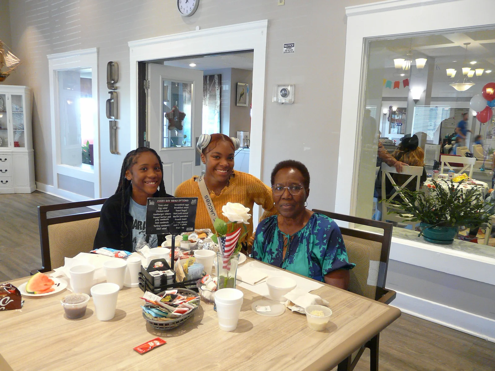 American House Farmington Hills, senior living community offering independent living, assisted living, memory care, and respite care in Farmington Hills, MI, resident smiling with family