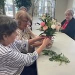 Orchard Heights Gracious Retirement Living Hawthorn Senior Independent Living in Clermont, Florida residents designing flower bouquets