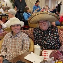 Meadowlark Estates Gracious Retirement Living Hawthorn Senior Independent Living in Lawrence, Kansas resident with family