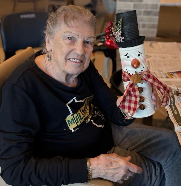 The Waters of Pewaukee residents make snowmen as one of their Creative Corner Crafts