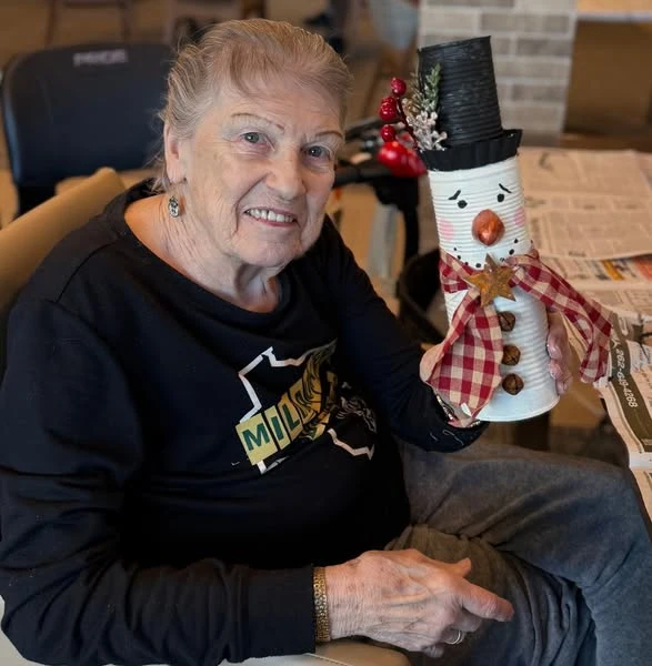 The Waters of Pewaukee residents make snowmen as one of their Creative Corner Crafts