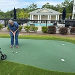 The Barclay at Little River resident putting and enjoying the outdoors