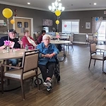 American House Westland Venoy senior living community offering independent living, assisted living, and respite care in Westland, MI, residents spending time together in the dining room