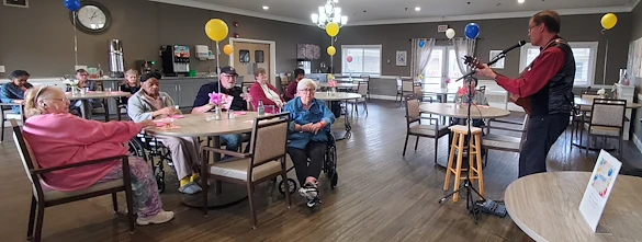 American House Westland Venoy senior living community offering independent living, assisted living, and respite care in Westland, MI, residents spending time together in the dining room