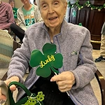 Charter Senior Living of Columbia resident smiling during holiday celebration