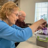 Whispering Pines Gracious Retirement Living Hawthorn Senior Independent Living in Raleigh, North Carolina residents gardening