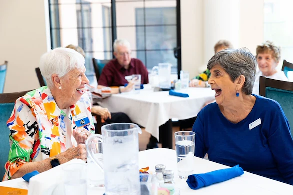 Friends laughing at Fellowship Square Surprise