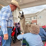Ascension Living Via Christi Village Manhattan Senior Living in Manhattan, Kansas residents petting an animal