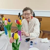 Ascension Living Via Christi Village Ponca City Senior Living in Ponca City, Oklahoma resident making a flower bouquet