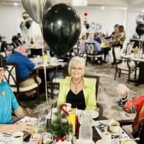 Sequoia Grove Gracious Retirement Living Hawthorn Senior Independent Living in Granite Bay, California residents at a party in the dining room
