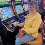 Cascadia Village Senior Living by Cogir in Sandy, Oregon resident at the slot machine at the casino