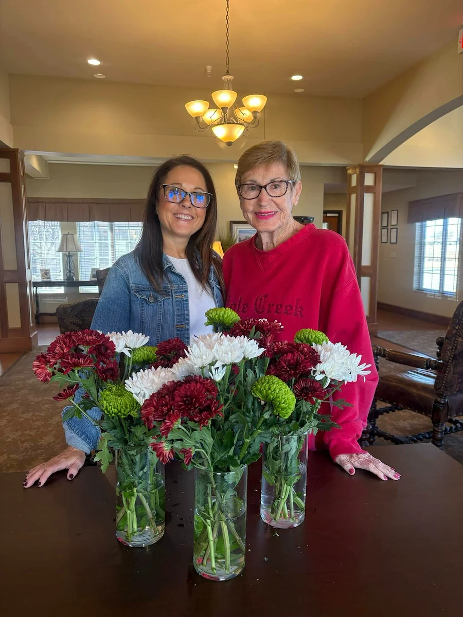 Credo Senior Living - Wichita, KS, resident with floral arrangements from activity
