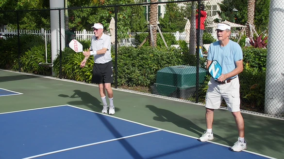 John Knox Village Of Florida, Inc. CCRC senior living in Pompano Beach, FL residents playing tennis