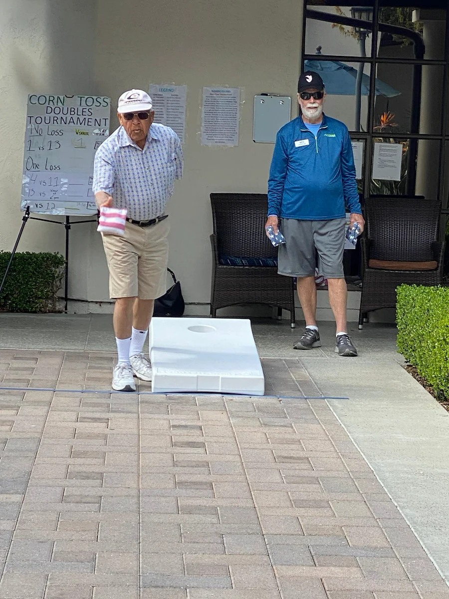 Covenant Living at the Samarkand in Santa Barbara, CA, resident engagement through outdoor activity - cornhole