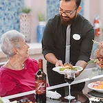 Friendly Server delivering dinner