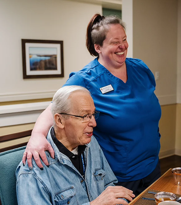 Concord Place Senior Memory Care in Knoxville, TN resident socializing with a staff member