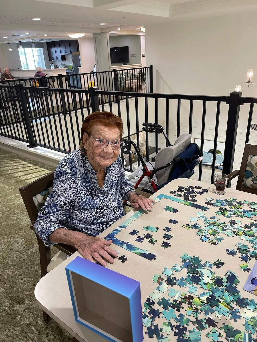 Charter Senior Living of Brookfield resident enjoying doing a puzzle
