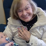 Porter Place Assisted Senior Living Memory Care in Tinley Park, IL resident holding a baby